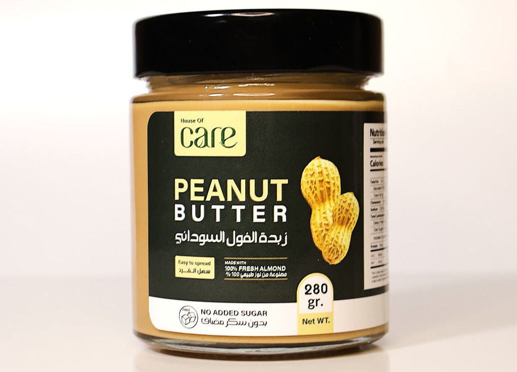 Jar of Care peanut butter on a white background